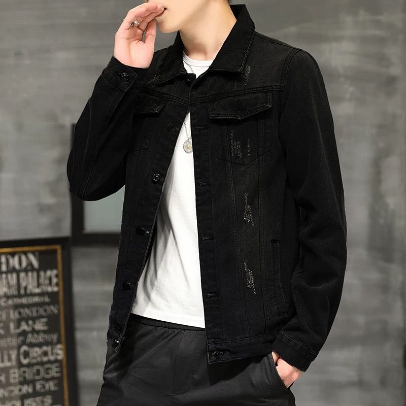 X08 black men's jacket worn open over a white top